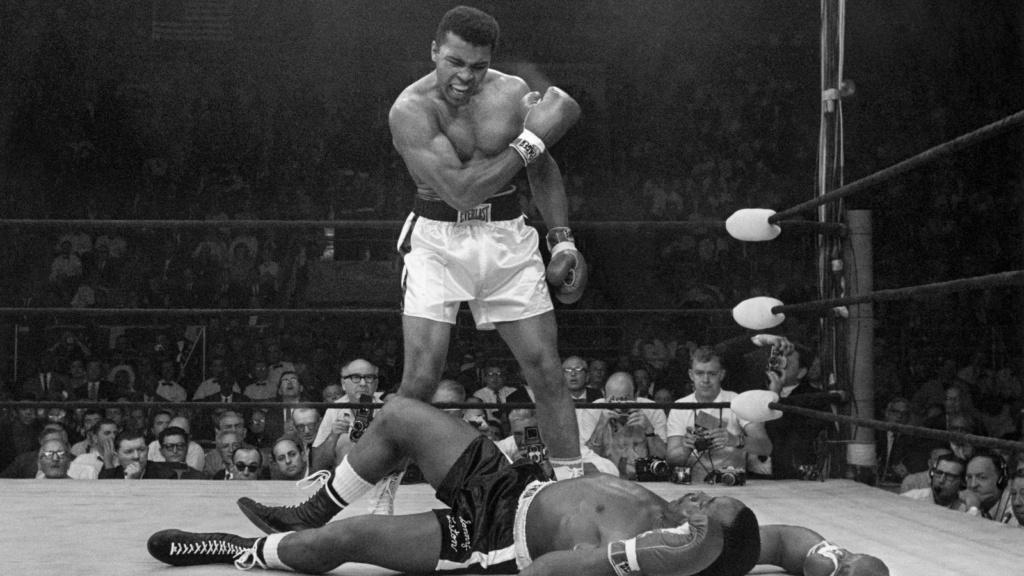 Muhammad Ali, a firm believer in hard work, stands triumphant over Sonny Liston.